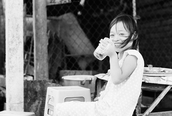 Cheerful Girl With A Big Glass (Vietnam)