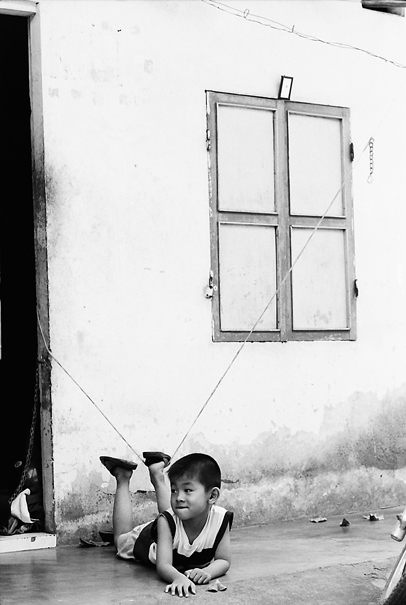 Boy Lying Down On The Floor (Vietnam)