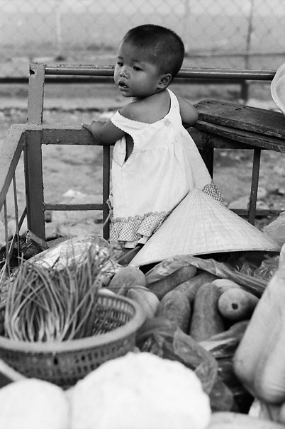 Baby Surrounded By Vegetables (Vietnam)