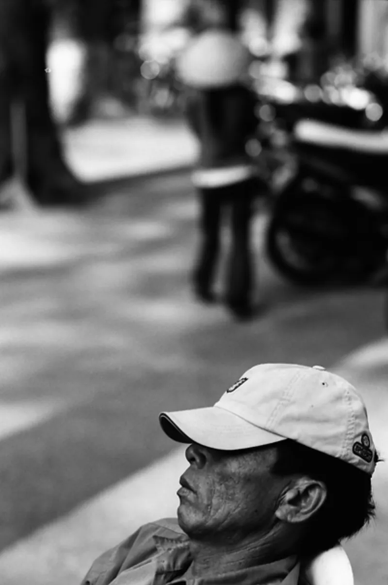 Man sleeping by loud roadside