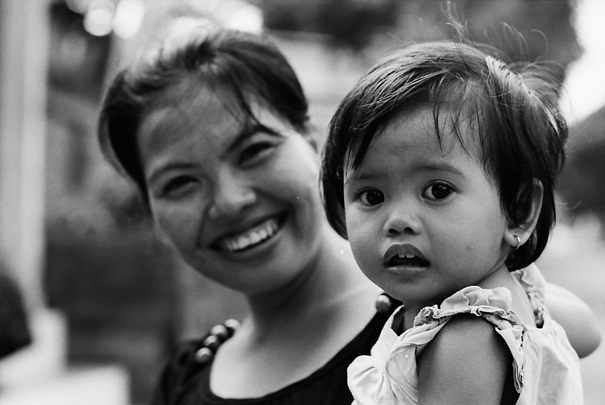 Laughing mother and mystified baby