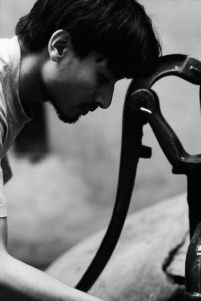 Man Drawing From The Well (Nepal)