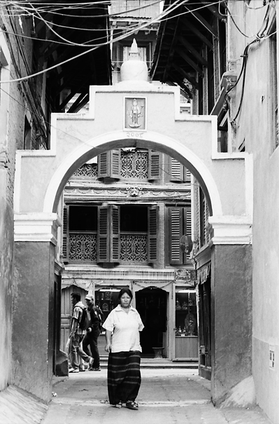 Woman Passing Through The Gate (Nepal)