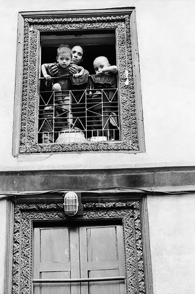 Mother And Her Two Sons By The Window (Nepal)