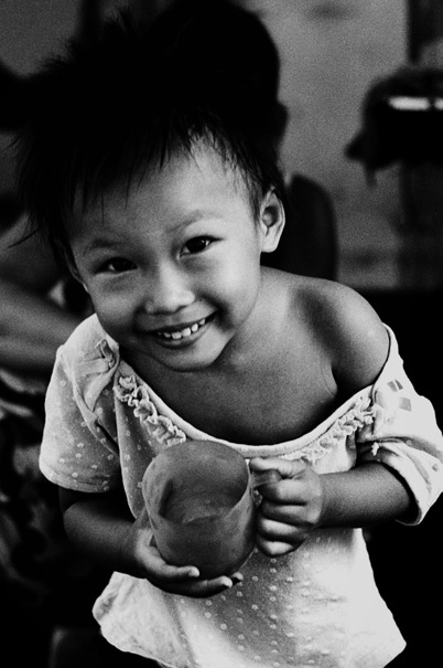 Girl peeking into lens curiously