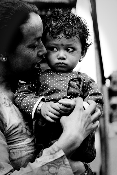 Suspicious Baby Held By Its Mother (Nepal)