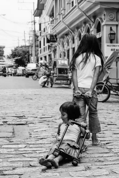 Girl being dargged by friend