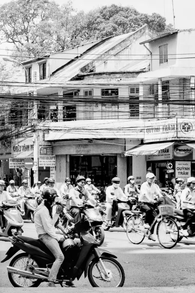 Woman lingering on edge of busy street