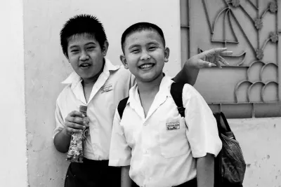 Two school boys smiling