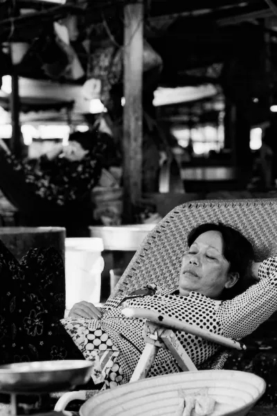 Woman taking nap in market