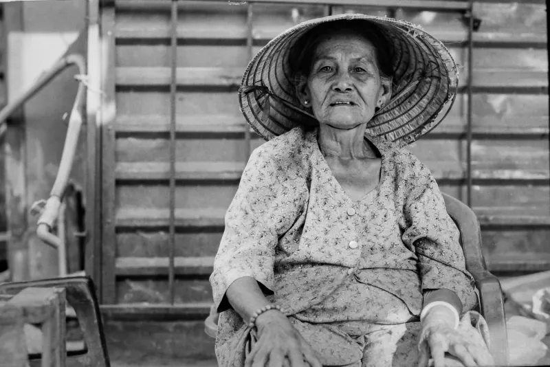 The older woman looking silently