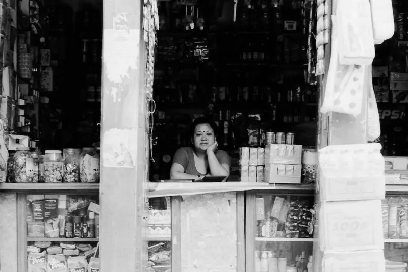 Woman tending to a grocery store