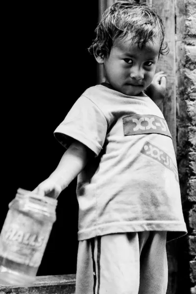 Little kid with plastic container