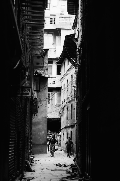 Figures In The Dark Alleyway (Nepal)