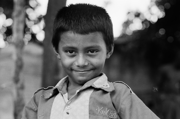 Boy standing with chin lowered