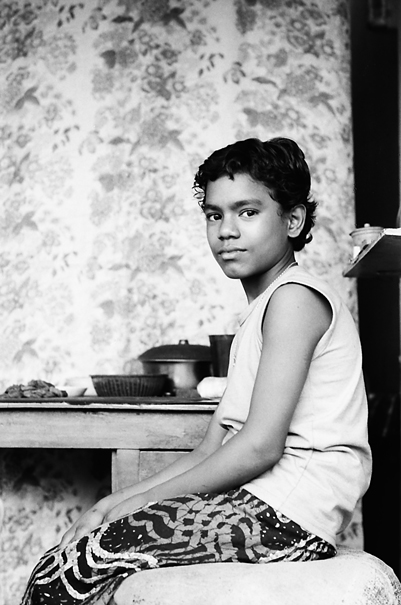 Boy looking after shop