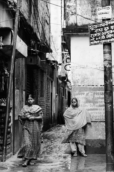 Two women at entrance of lane