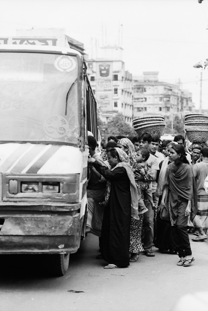 People getting inside of bus