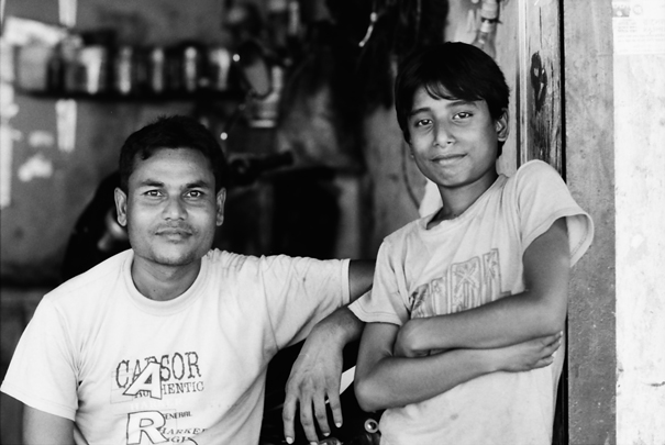 Two Disengaged Men In A Shop (Bangladesh)