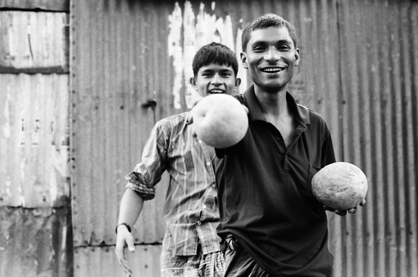 Man poking forward coconut