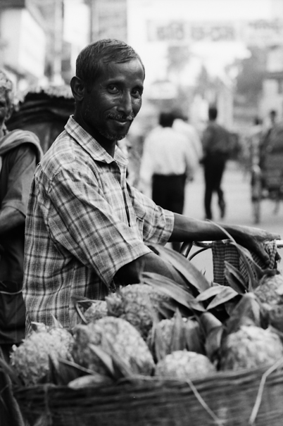 Man selling pineapple
