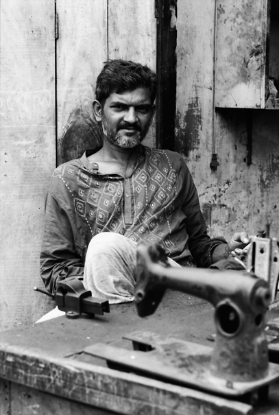 Man and sewing machine
