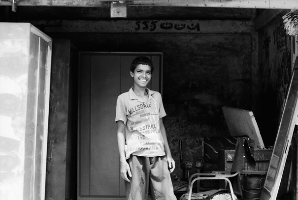 Boy Was Smiling In The Garage (Bangladesh)