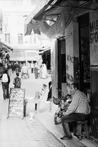 Man sitting in storefront