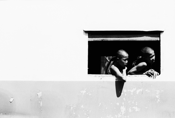 Monks leaning out from window