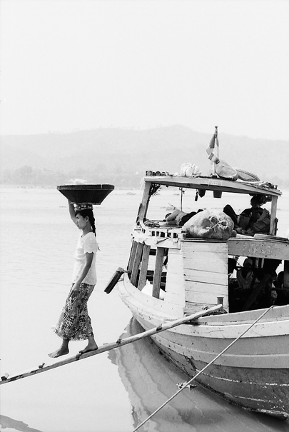 Disembarkation With A Big Basket On Her Head (Myanmar)