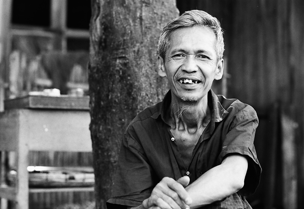 Man Sitting At The Base Of A Tree (Myanmar)