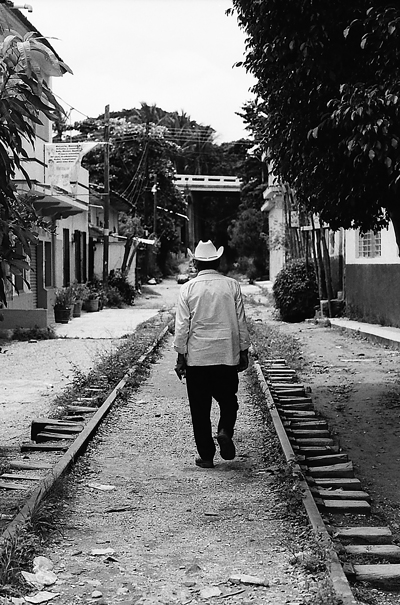 Man waling disused railway
