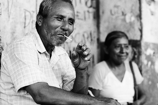 Man putting cigarette into mouth