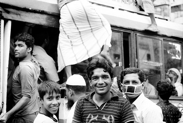 Three Men At A Bus Stop (Bangladesh)