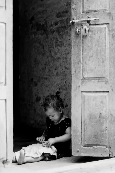 Little girl playing alone