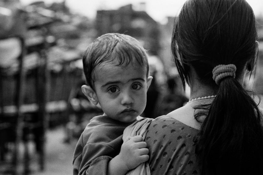 baby being held by mother