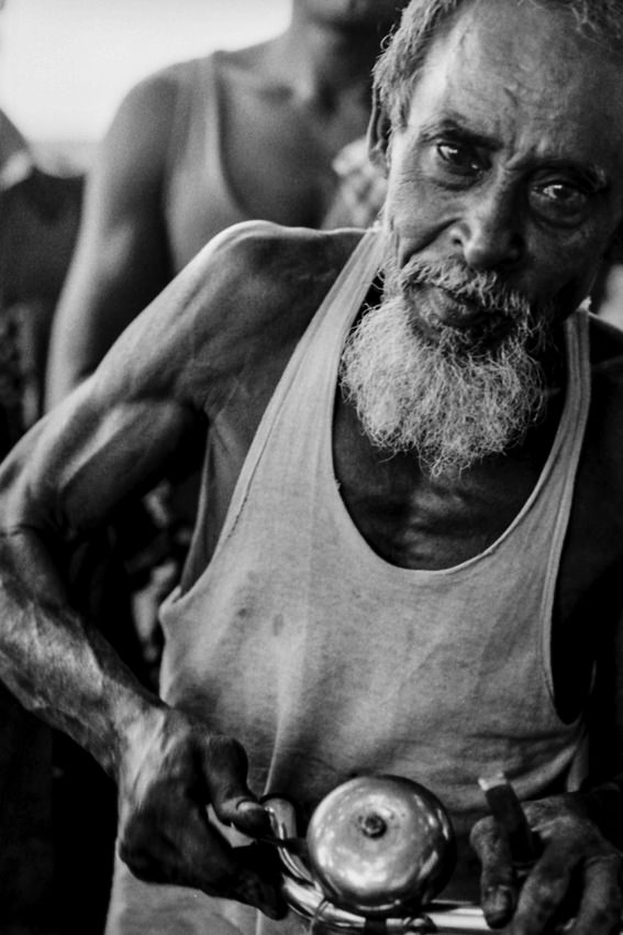 Man ringing bell of cycle rickshaw