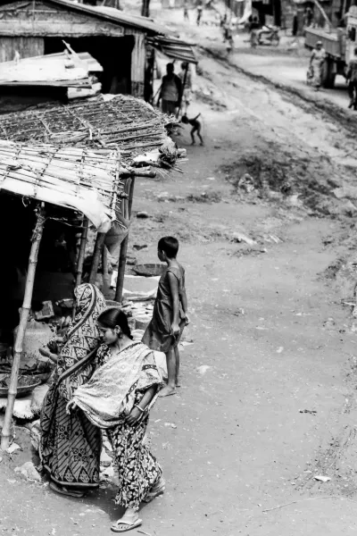Woman walking unpaved road