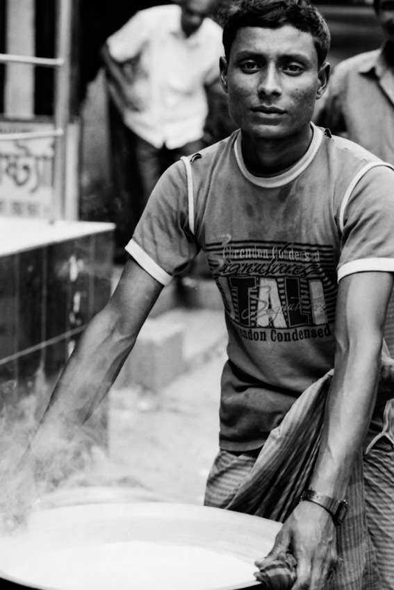 Man carrying steaming pot