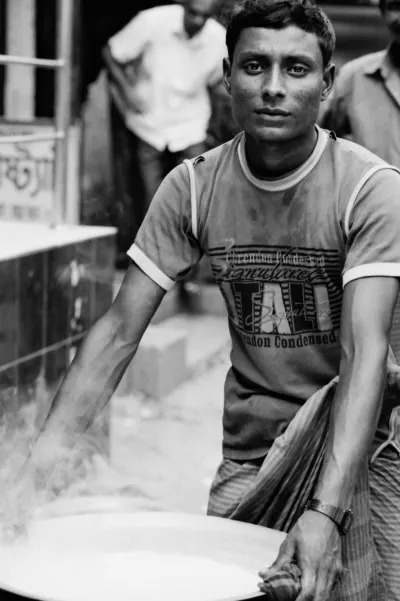 Man carrying steaming pot