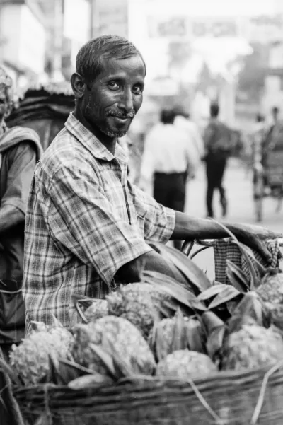 Man selling pineapples