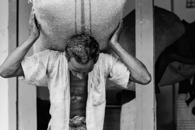 Man with a big hemp sack on his back