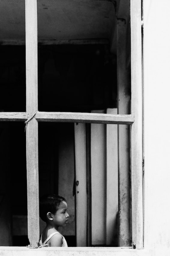Girl on other side of window
