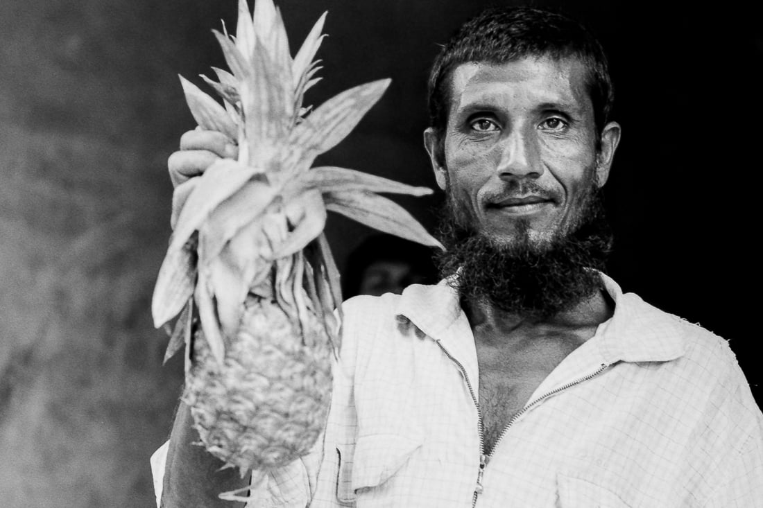 Man holding pineapple