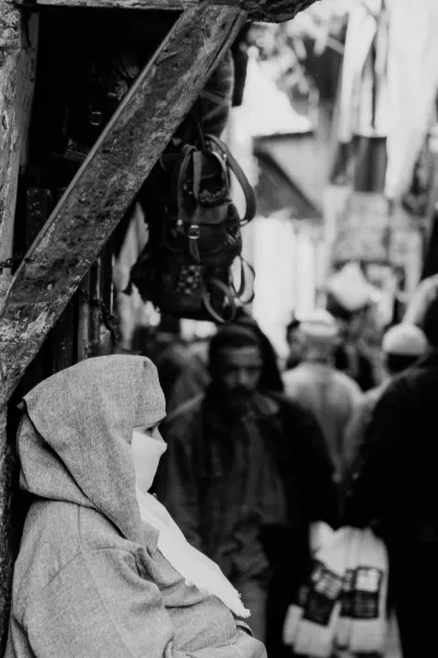 Woman standing in street corner