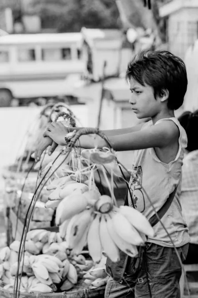 Boy selling bananas