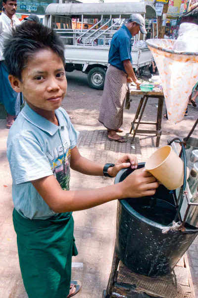 Boy selling drinking water by roadisde