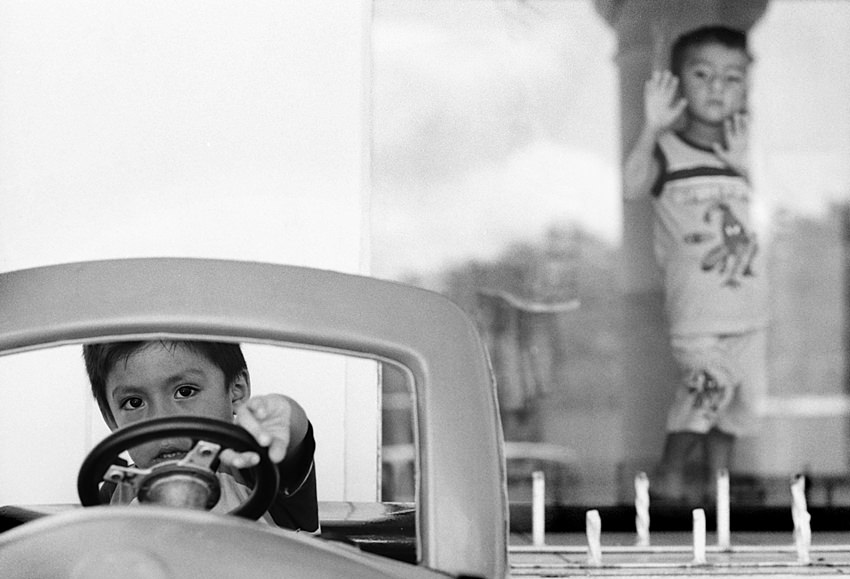 boy driving toy car