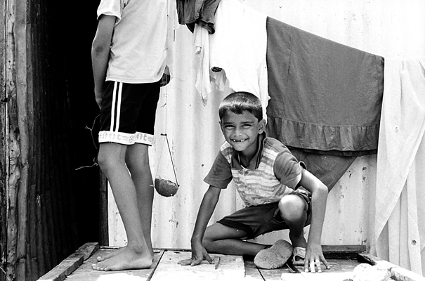 Crouching Boy's Smile (India)