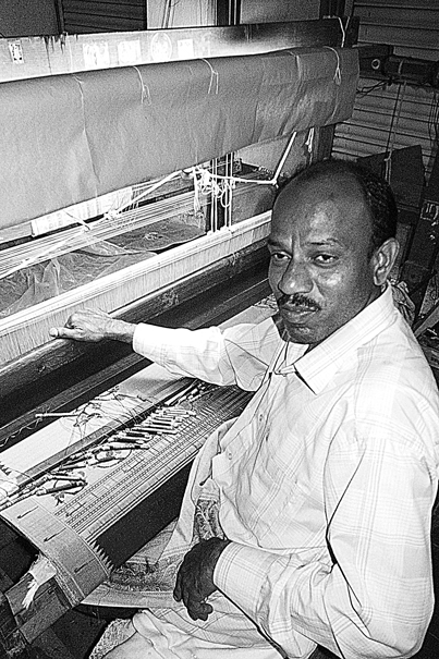 Man Weaving Himroo (India)